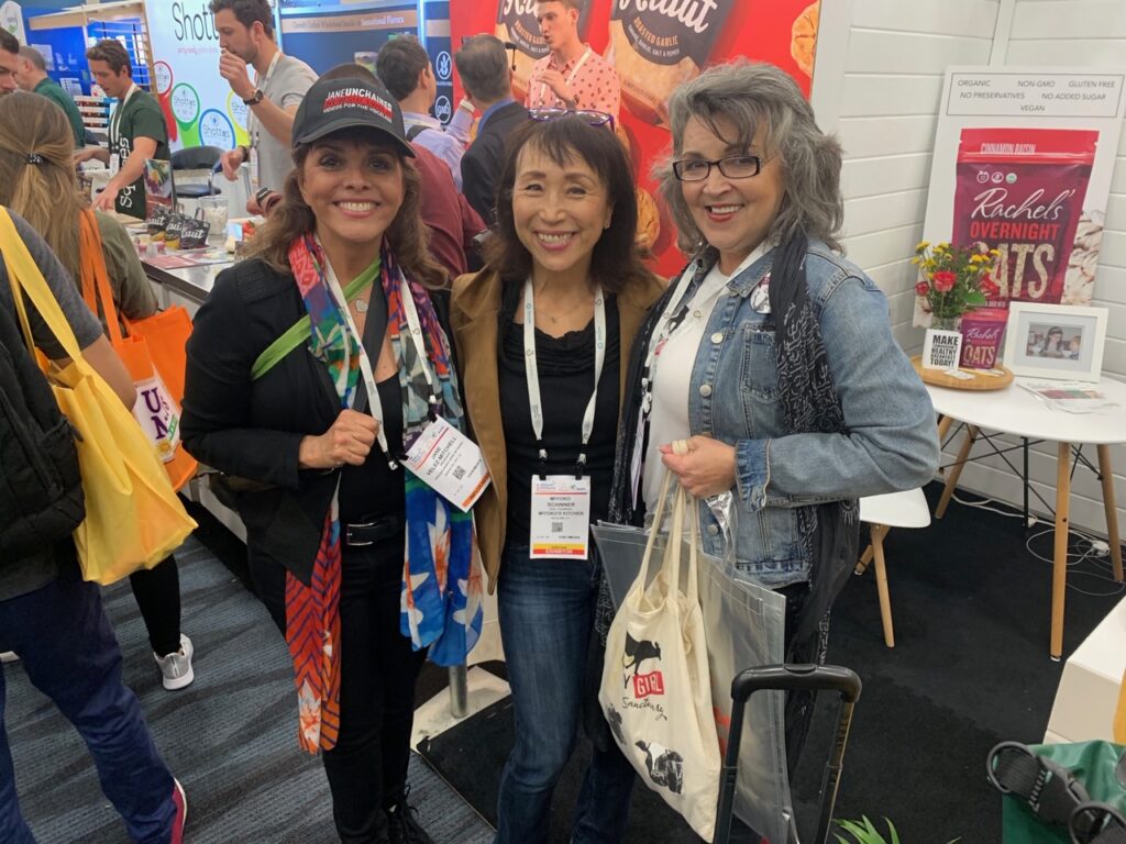 Three women fighting the dairy industry in a vegan event