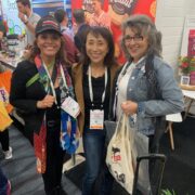 Three women fighting the dairy industry in a vegan event