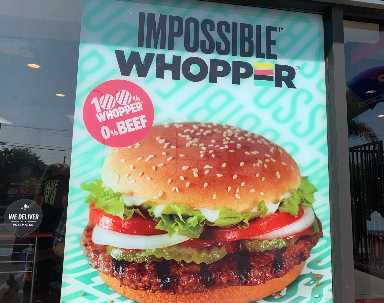 Burger King poster outside restaurant.