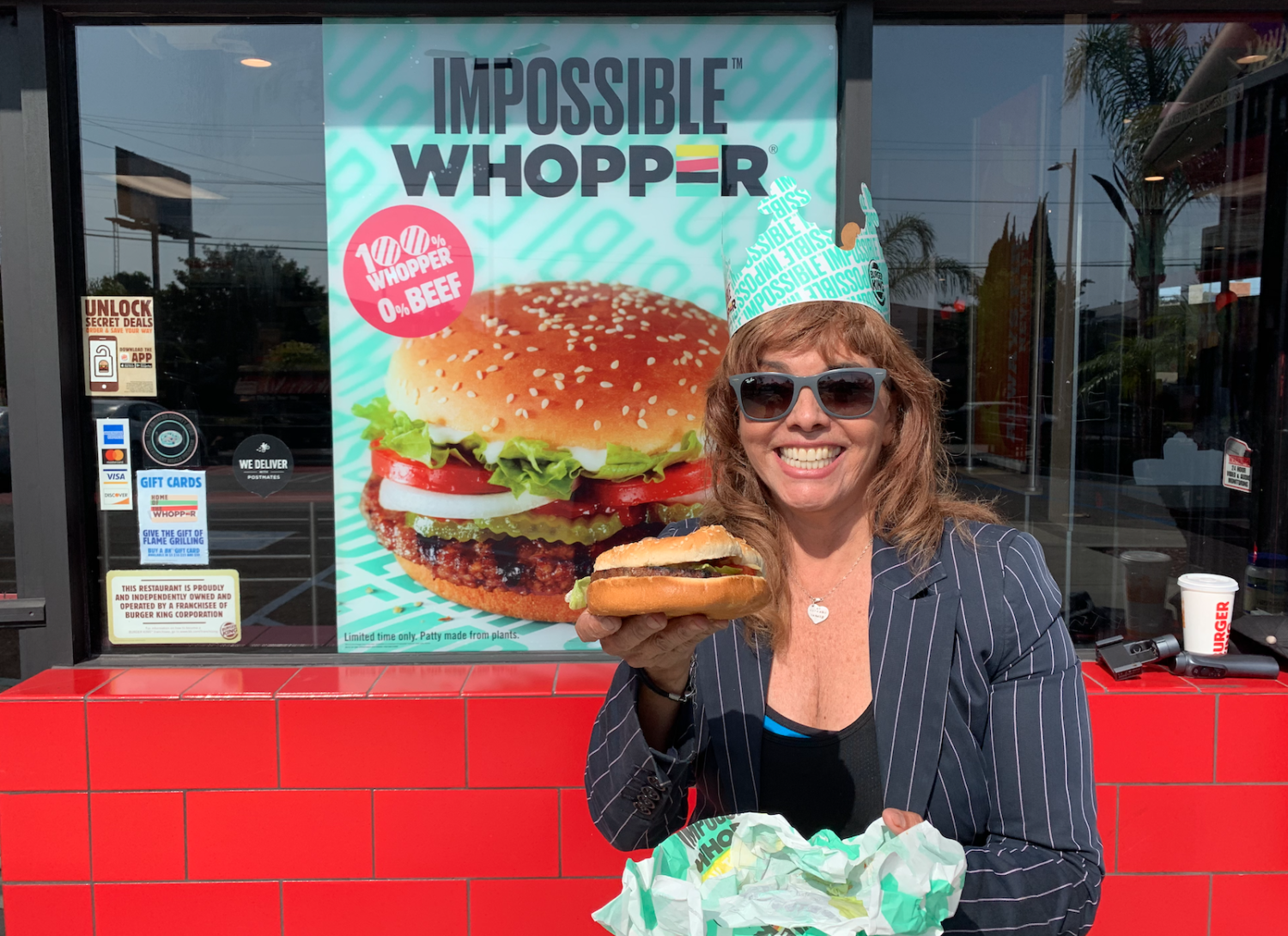 Jane holds up an Impossible Whopper