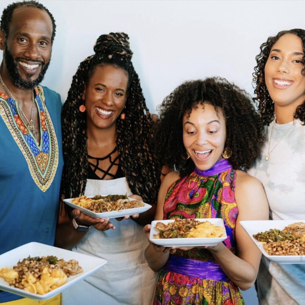 Group photo with Marlon and vegan chefs Gabrielle, Brooke and Malinda cooking together on Juneteenth. 