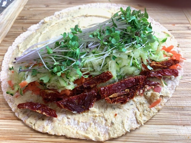 Hummus and Sun Dried Tomato Wrap showing layout of the vegetables