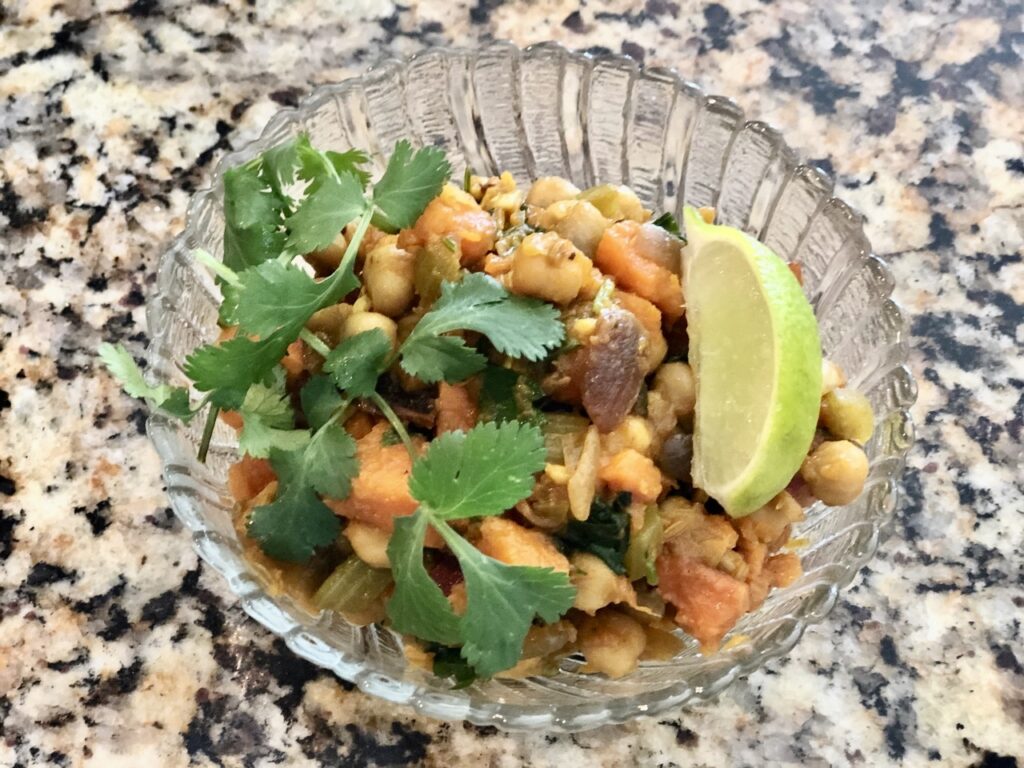 The plated sweet potatoes and chickpeas in chili sauce