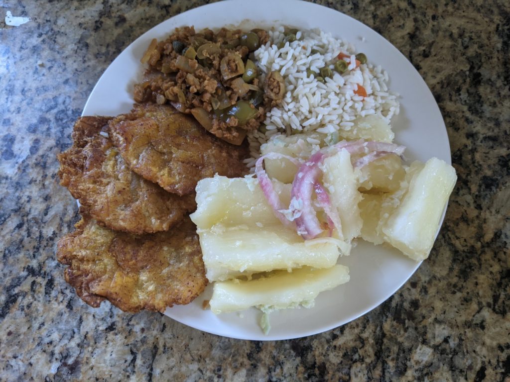 finished vegan Picadillo with rice, Yucca, and fried Plantains