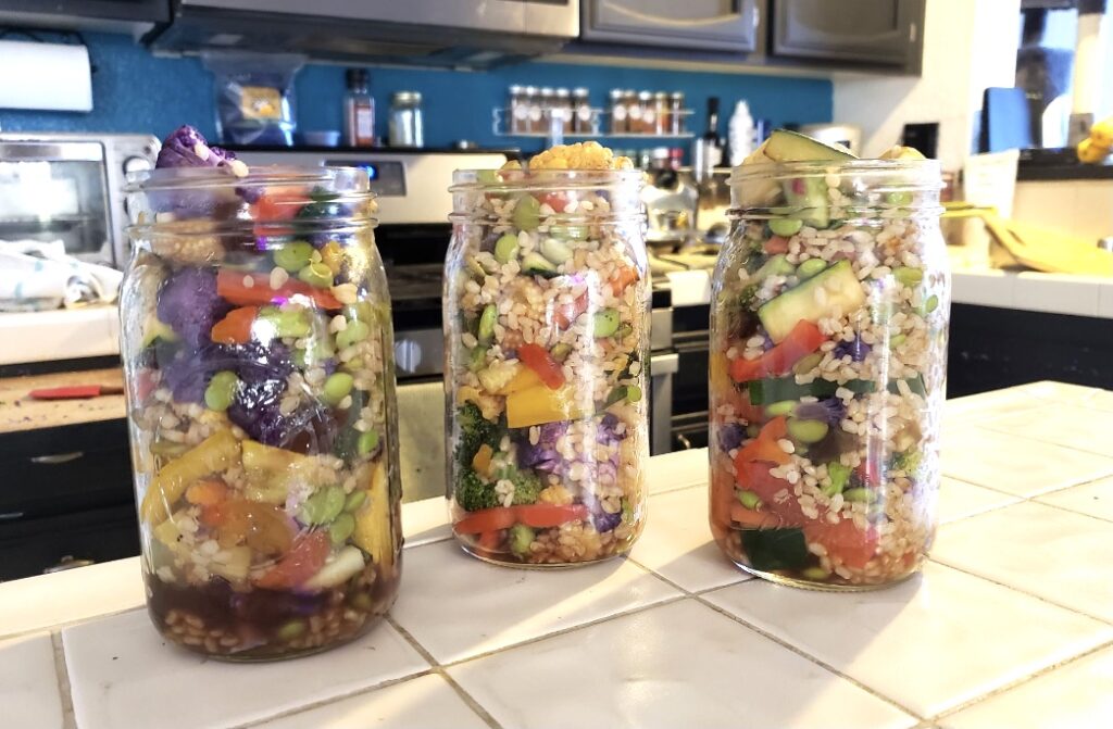Mason jars filled with veggie stir fry