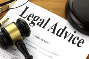 Gavel resting on a paper saying "Legal Advice"