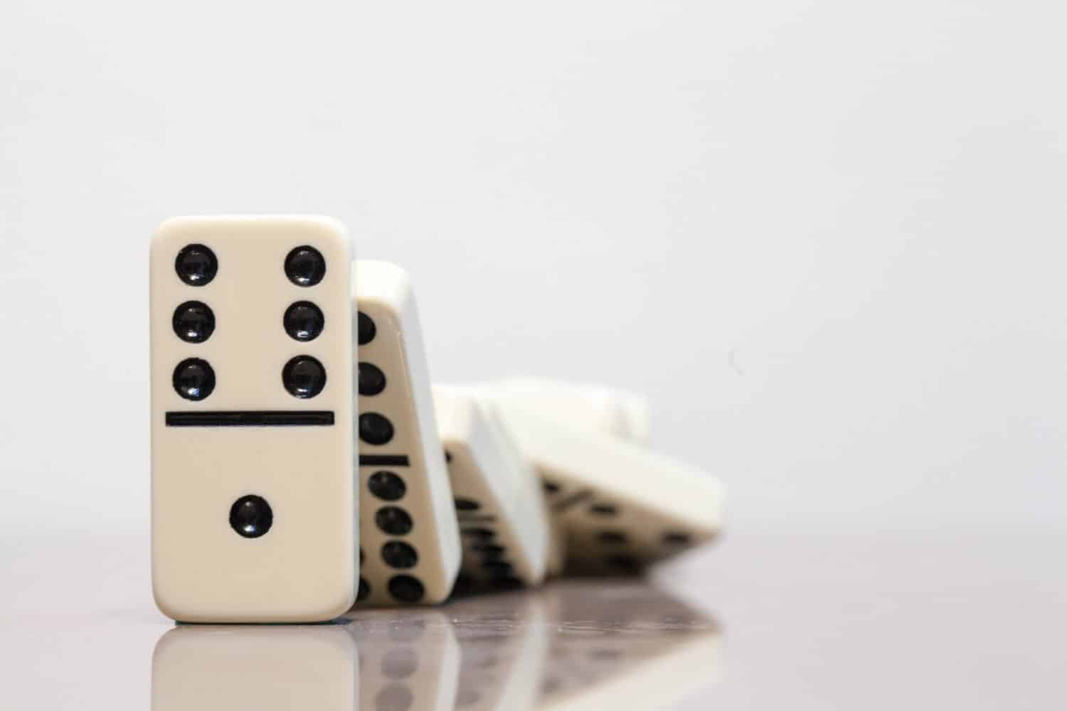 Domino pieces falling in a domino effect 