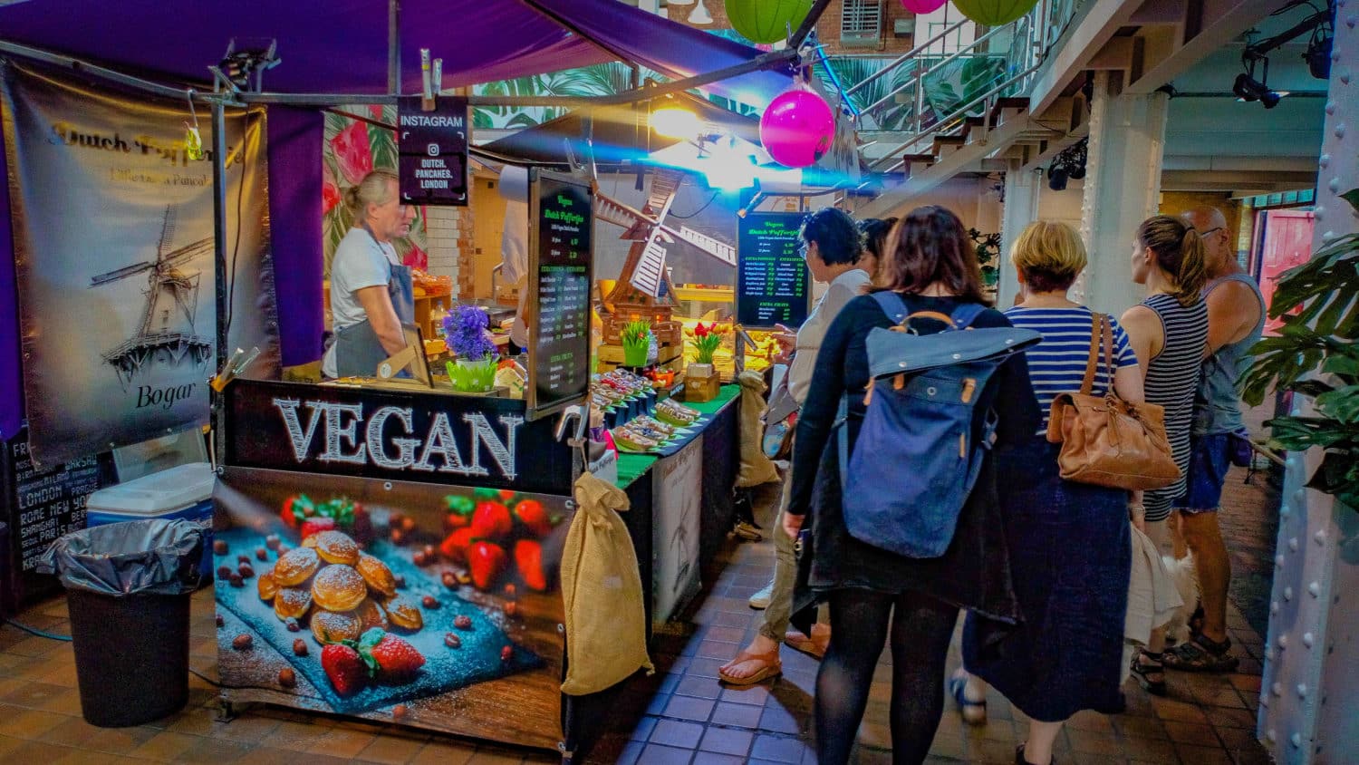 vegan food stall in a market, part of the systemic change we need