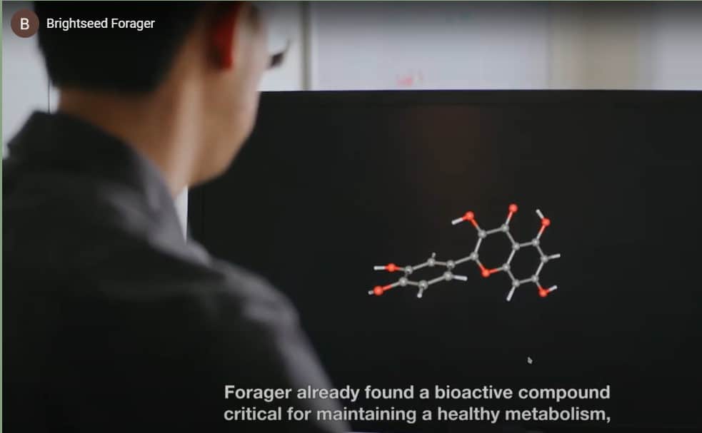 Man looking at a diagram of a molecule in a screen