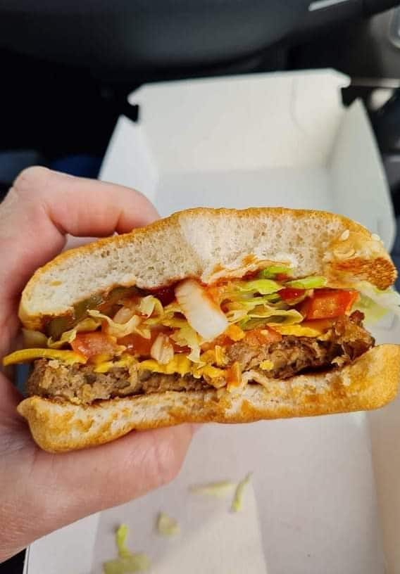A McPlant burger bitten in half