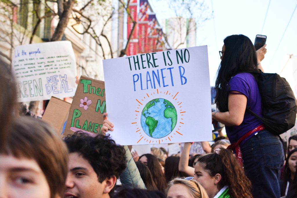 Climate protesters with a sign saying There Is No Planet B