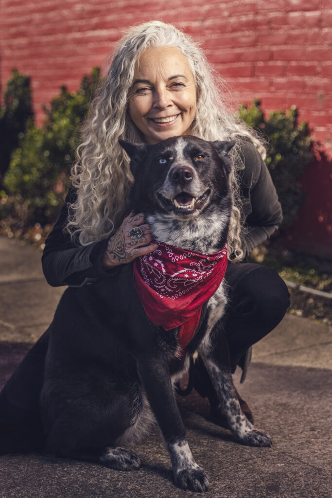 Woman and dog smiling