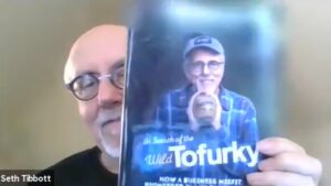 Tofurky’s Founder Seth Tibbott showing his book In Search of the Wild Tofurky!