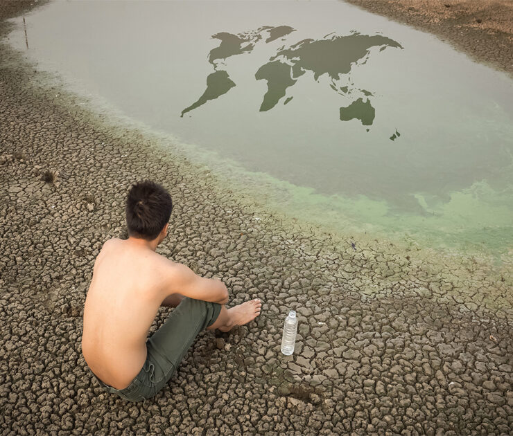 Water crisis world map, man sit on cracked earth near drying wat. By releon8211