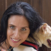 Nina Jackel from Lady Freethinkers hugging a dog