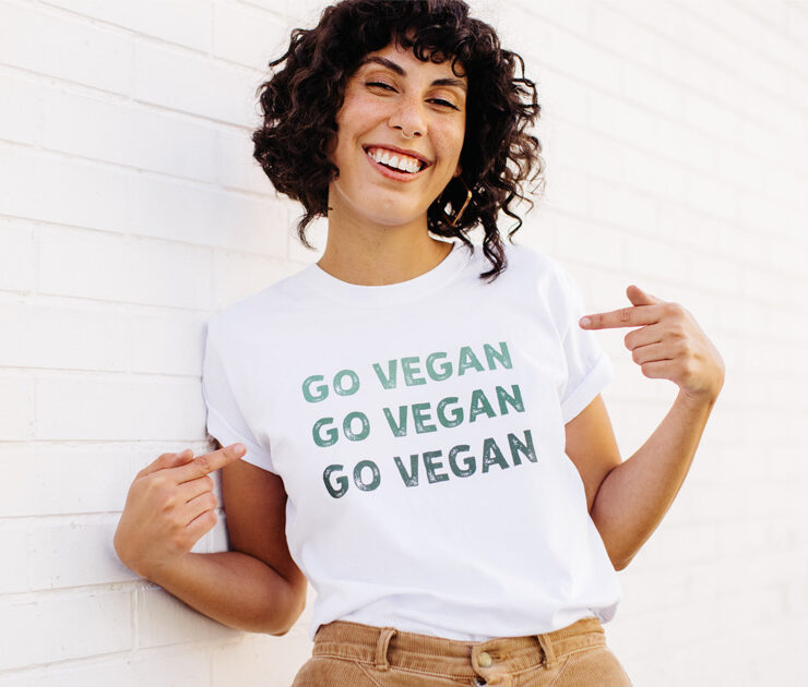 Happy vegan activist wearing a GO VEGAN shirt.