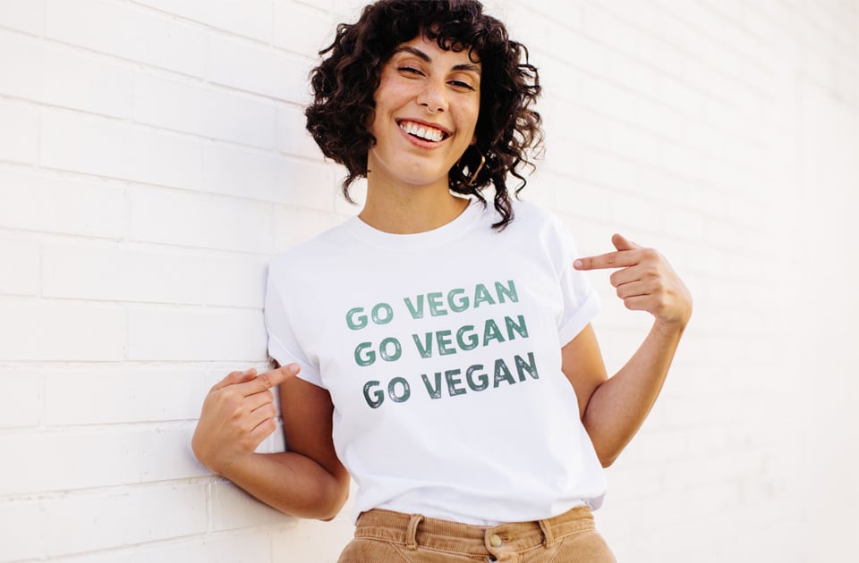 Happy vegan activist wearing a GO VEGAN shirt.