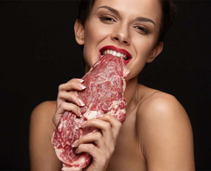 Woman Biting Raw Red Beef Steak Meat