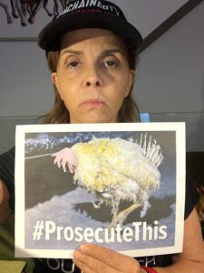 Jane Velez-Mitchell with #ProsecuteThis sign
