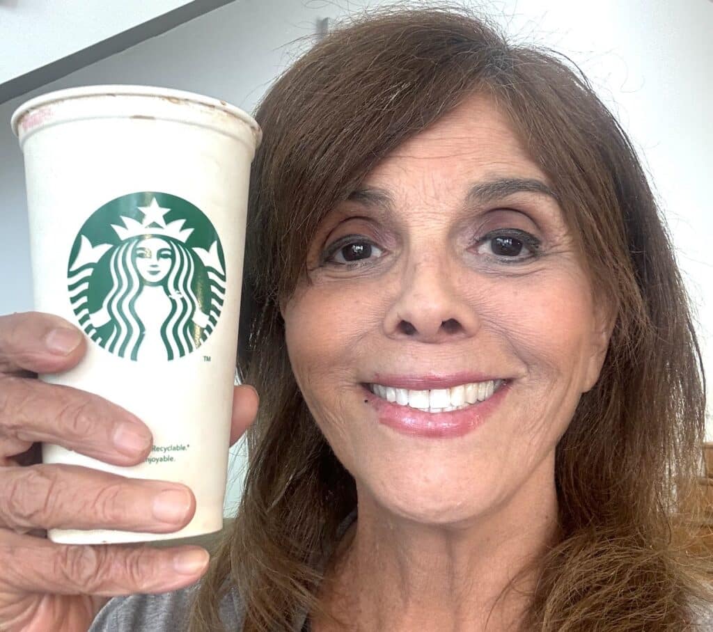UnchainedTV'S Jane Velez-Mitchell holds Starbucks cup