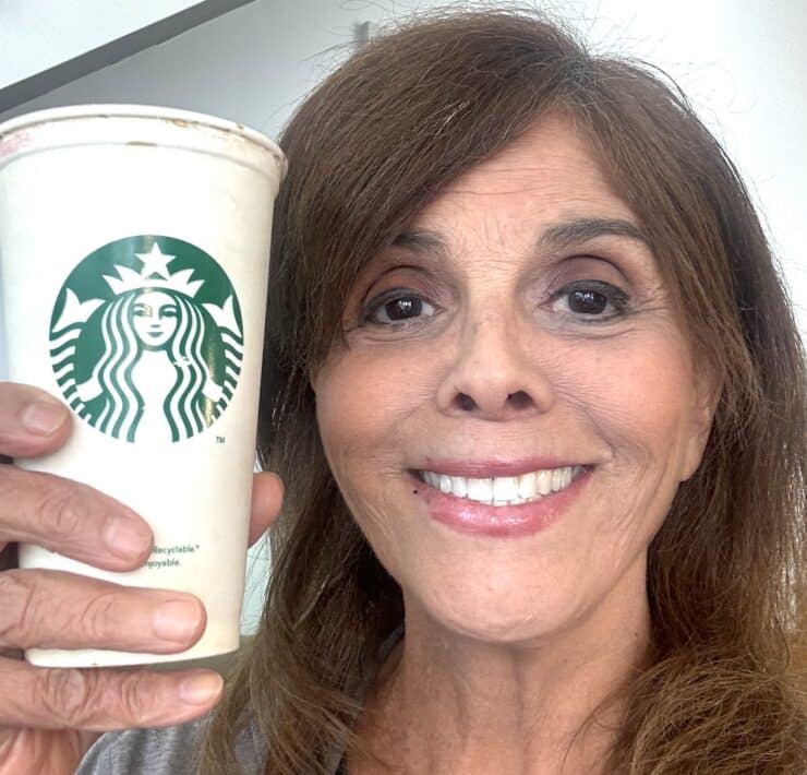 UnchainedTV'S Jane Velez-Mitchell holds Starbucks cup
