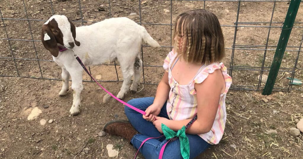 Jessica Long daughter with her goat Cedar, photo Advancing Law for Animals
