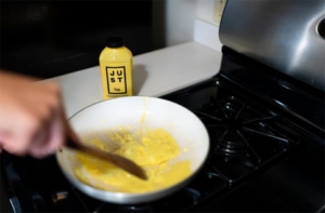 Person cooking Just Egg substitute alternative for scrambled omelet 