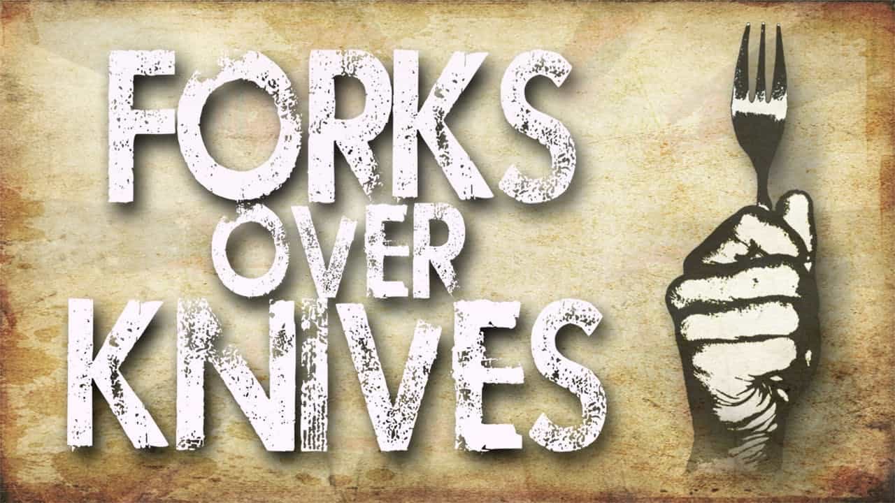 Forks Over Knives documentary logo with a fork in place of the letter 'I' against a rustic brown background.